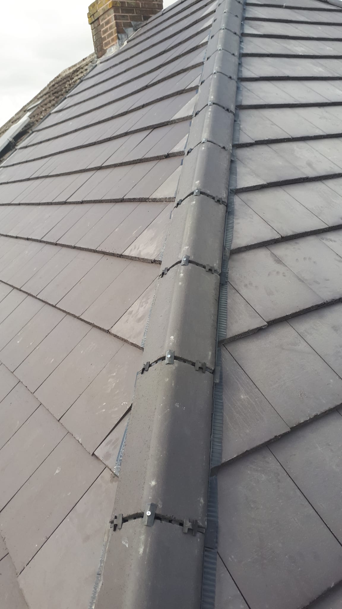 Dry ridge and hip system detail on new tiled roof