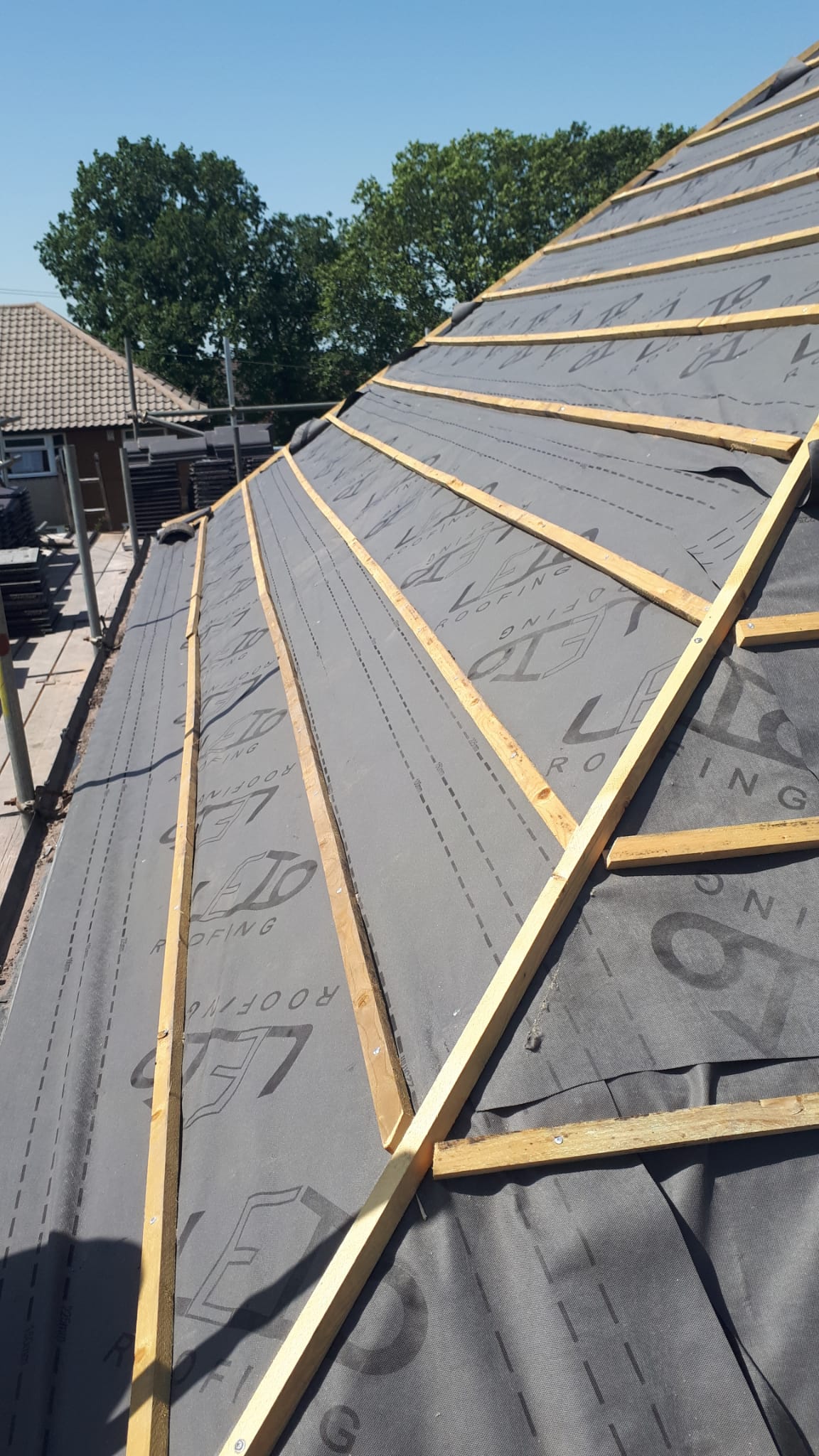 New breathable membrane and battens laid on stripped roof
